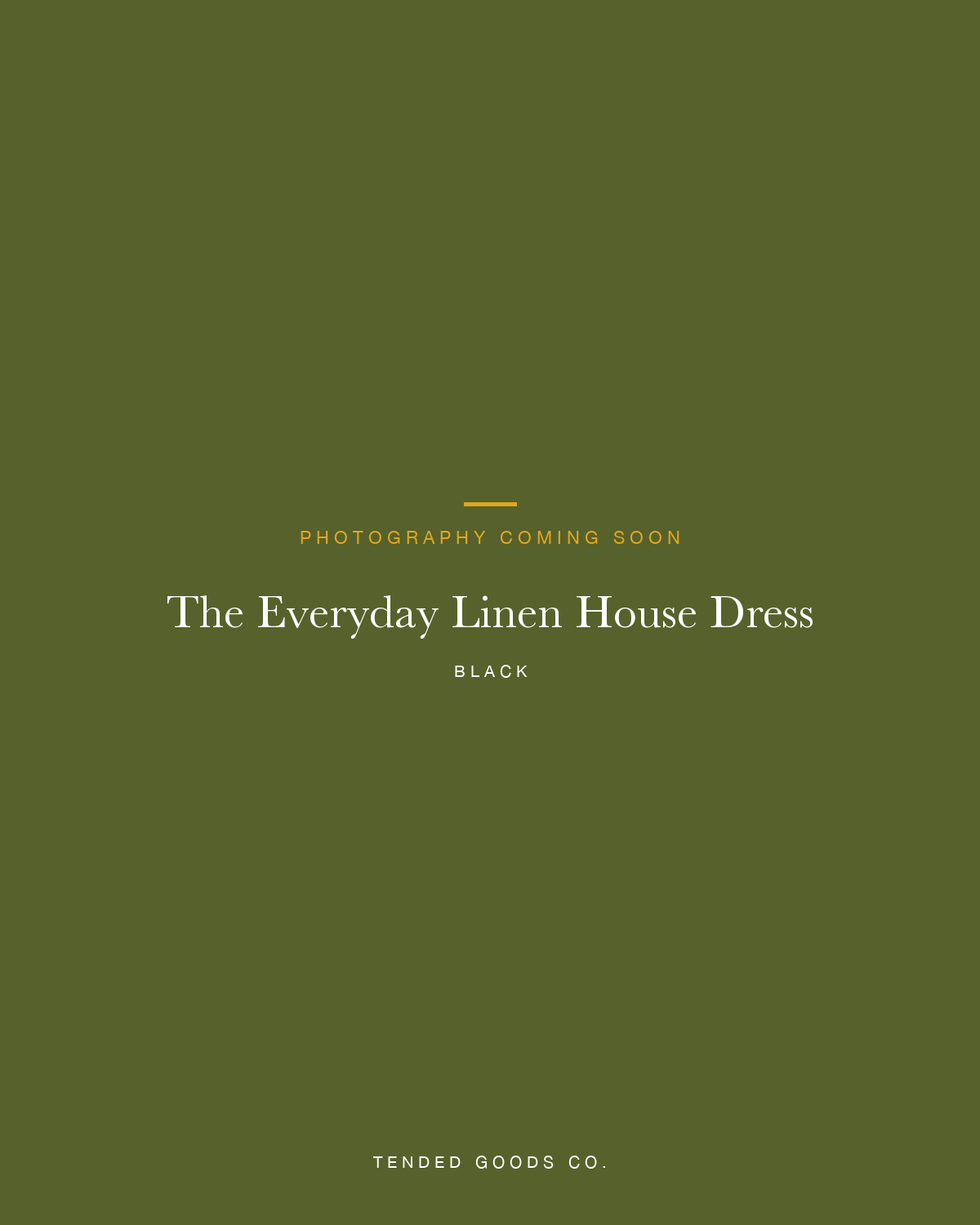 Woman wearing a black 100% linen house dress at home — The Everyday Linen House Dress